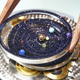 Illustration for article titled A Watch That Puts an Entire Planetarium on Your Wrist